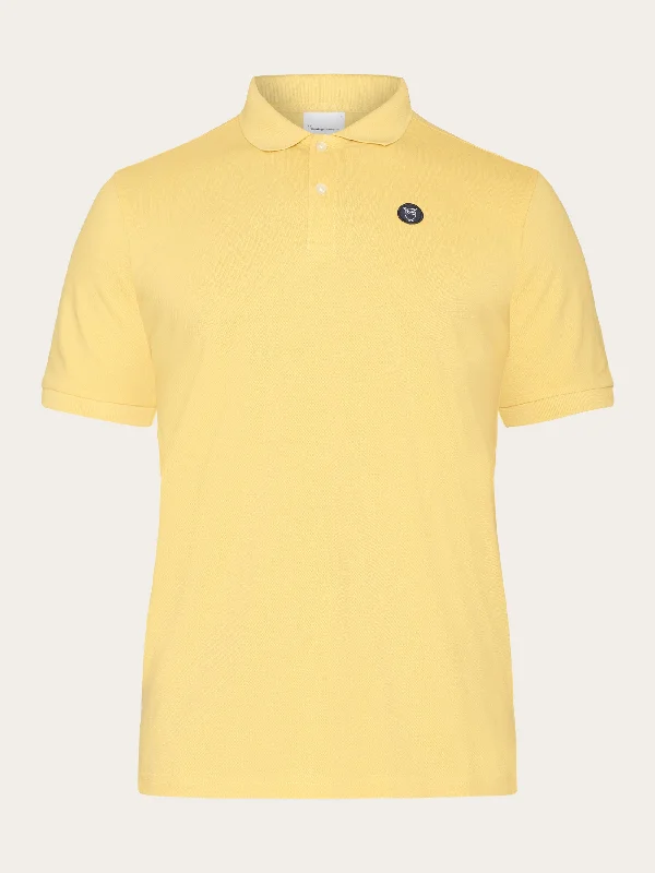 Men's short-sleeve neutral casual-bold-rich-boxy-swirl top-Basic badge polo - Misted Yellow